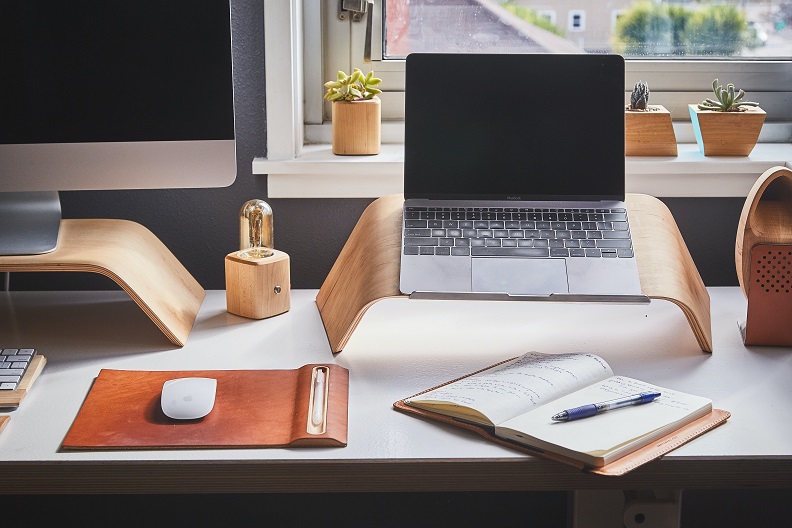 Phone and laptop on a home desk